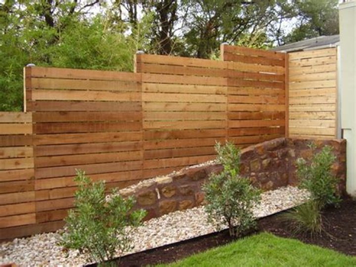 can i build a fence next to my neighbours uk