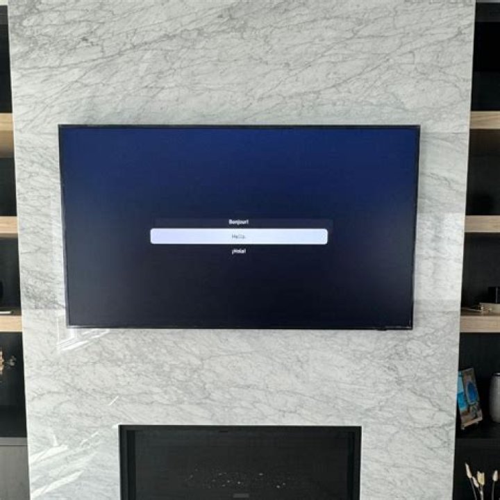 Can you mount a TV without putting holes in the wall
