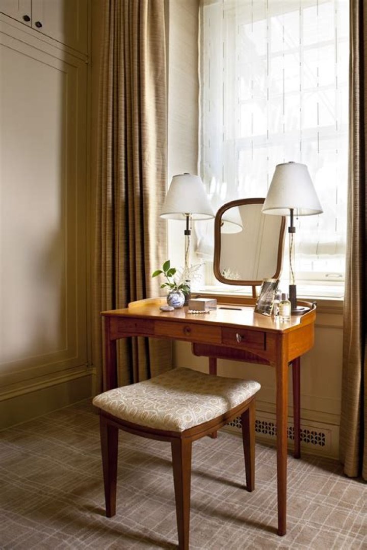 dressing table in front of window
