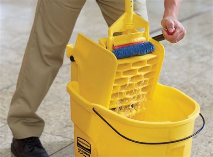 How do you clean a mop bucket