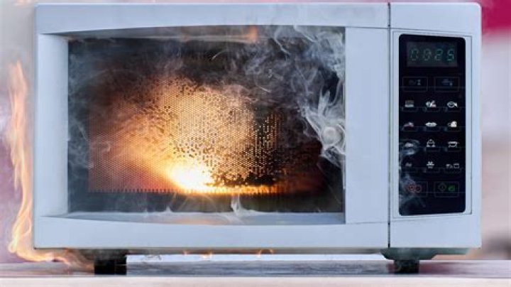 How do you keep water from exploding in the microwave?