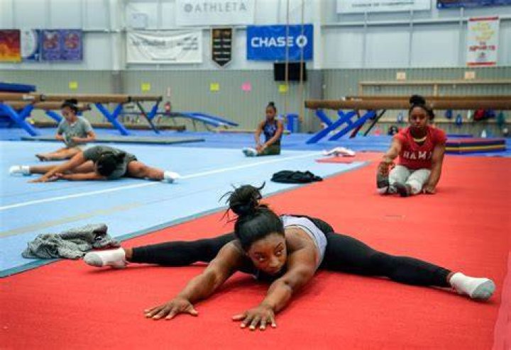 simone biles parents gym