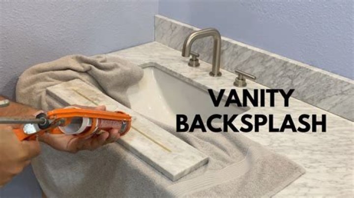 What do you use to attach marble backsplash