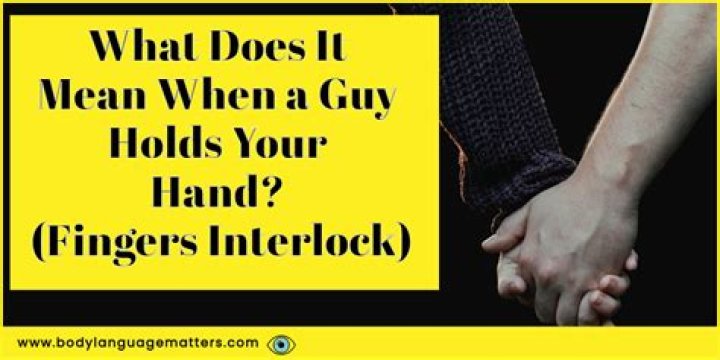 What does it mean when a guy holds your hand while interlocking fingers?
