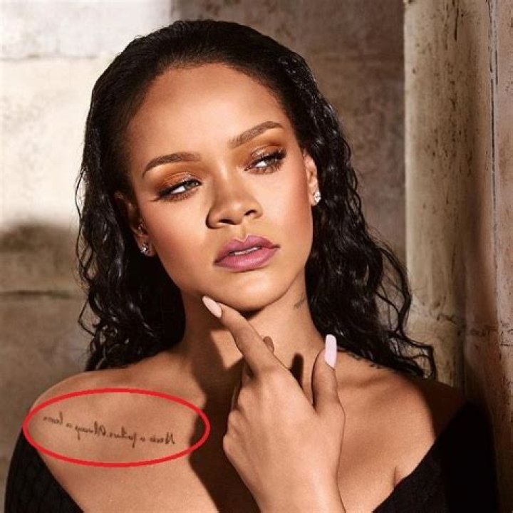 What does Rihanna's chest tattoo say?