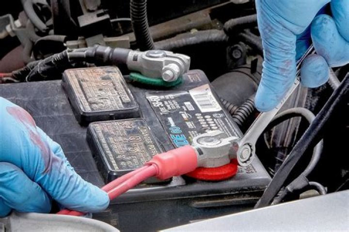 Which terminal do I disconnect first when changing a car battery?