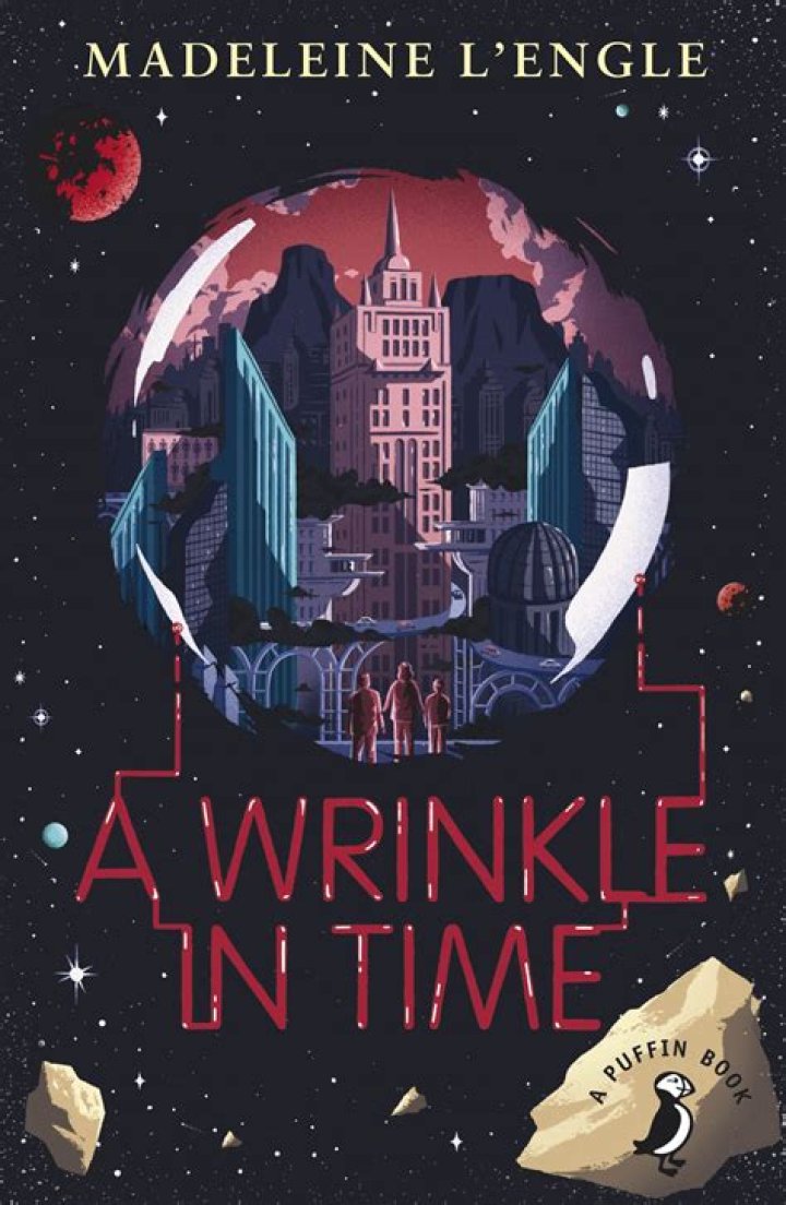Who comes to visit the house in a wrinkle in time